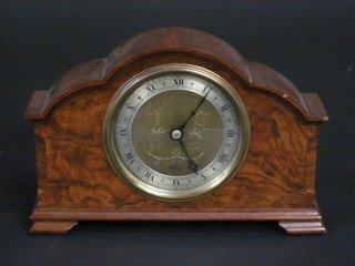An Elliott mantel clock with gilt dial and silvered chapter ring contained in a walnut arch shaped case ILLUSTRATED