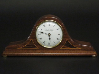 A battery operated mantel clock with enamelled dial and Arabic  numerals by Knight & Gibbons, contained in an inlaid mahogany  Admiral's hat shaped case