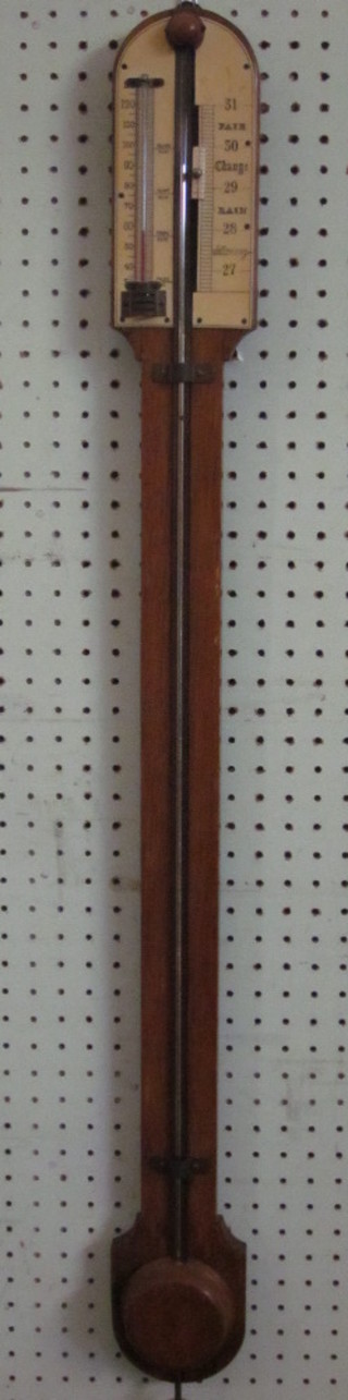 An 18th Century style mercury stick barometer contained in an  oak case ILLUSTRATED