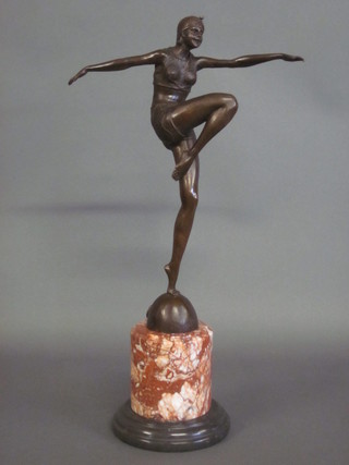 An Art Deco style figure of a bronze dancing lady, raised on a marble base 22"