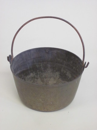 A circular brass preserve jar with iron swing handle 12"