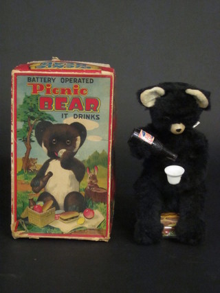 A battery operated picnic bear and a set of silver plated fish knives and forks