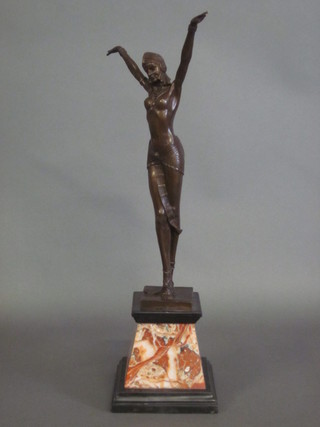 An Art Deco style figure of a standing bronze lady with  outstretched hands, raised on a shaped marble base 28"