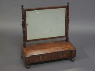 A 19th Century rectangular plate dressing table mirror contained  in a mahogany frame, the base fitted 2 drawers, raised on bun  feet 22"