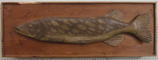 A carved wooden figure of a pike 41"