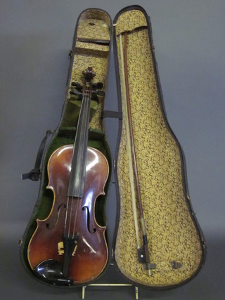 A violin labelled Owen Leeds with 14 1/2" back, complete with  bow and fibre carrying case