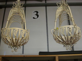 A pair of circular white painted metal lamp or basket holders