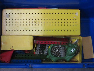 A blue plastic crate containing a collection of various Meccano