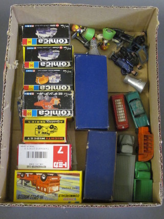 A collection of Tomica toy cars etc