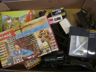 A box containing a collection of rails, locomotives, childs teaset  etc