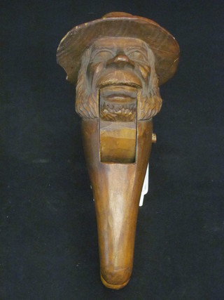 A pair of wooden nutcrackers in the form of an elderly gentleman 8"