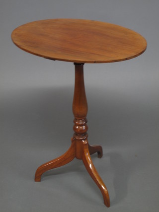 A Victorian oval walnut wine table, raised on a pillar and tripod  base 23"