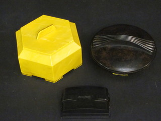 A Halex Art Deco yellow Bakelite dressing table jar and cover  4", a circular brown Bakelite jar 3" and 1 other