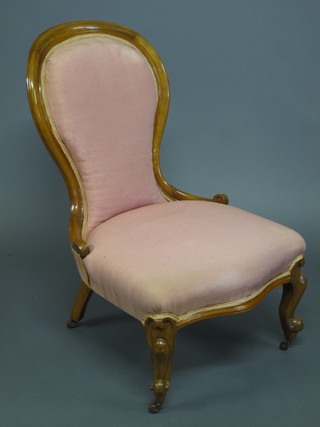 A Victorian mahogany show frame spoon back chair raised on cabriole supports