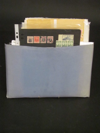 A blue card folder containing stamps