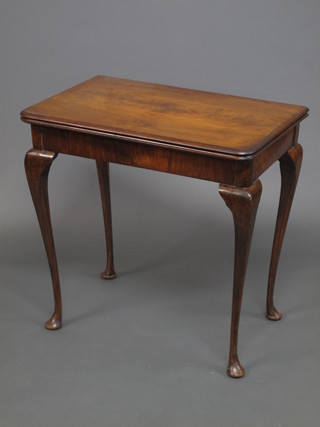 A 1930's walnut 2 tier card table, raised on cabriole supports 30"