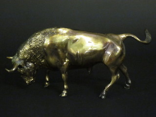 A gilt metal figure of a charging bull 14"