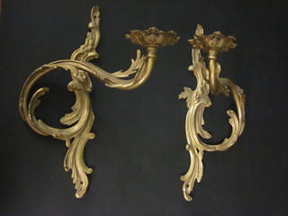 A pair of gilt metal wall light brackets