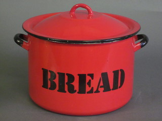 A circular red enamelled bread bid and cover 12"