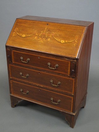 An Edwardian inlaid mahogany bureau, the fall front revealing a well fitted interior above 3 long graduated drawers, raised on  bracket feet 30"