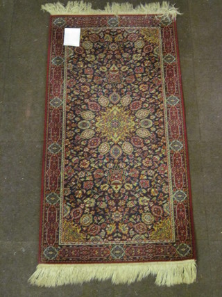 A red ground and floral patterned Persian design machine made  rug 5" x 28"