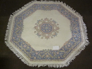 A white ground and floral patterned Indian rug 60"