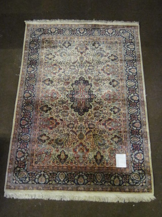 A fine quality silk Persian rug with central medallion within  floral borders 70" x 48"