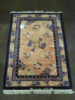 A 1920's pink and blue ground Chinese carpet 72" x 48"