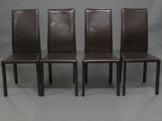 A set of 4 leather high back dining chairs