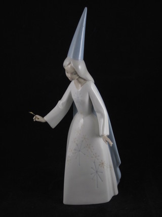 A Lladro figure of a standing Fairy with gilt metal wand, 11"
