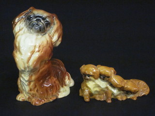 A Royal Worcester figure of 5 seated Pekinese the base with  black Worcester mark and 318, 3", together with a Beswick  figure of a standing Pekinese marked 1059, chip to base, 5"