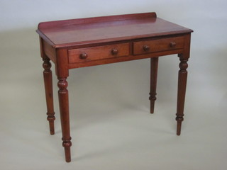 A Victorian mahogany side table with raised back fitted 2  drawers, raised on turned supports 35"