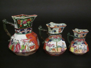 A set of 3 Victorian Masons Ironstone octagonal graduated jugs with Oriental scenes, the bases with black Masons mark ILLUSTRATED