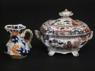 A Masons Ironstone oval sauce tureen and cover, the base with  brown Masons Ironstone mark 6", chip to lid and a Masons style  jug 3"