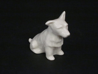 A Belleek figure of a seated Terrier, the base with green mark 3"