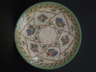 A Charlotte Rhead Crown Ducal circular charger with floral  decoration, based marked 660F, 12"