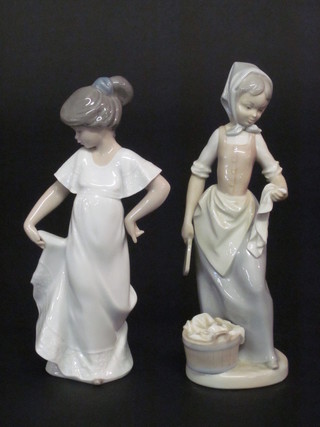 A Nao figure of a standing girl 9" and 1 other washer woman