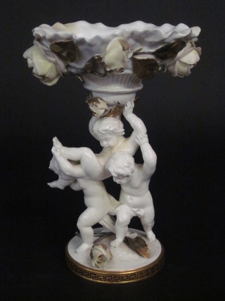 A Moore porcelain comport decorated cherubs, f and r, 13"