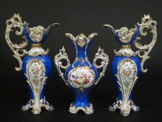 A Victorian Rockingham style garniture comprising blue glazed twin handled vase 10", 2 ewers 11" with blue banding and floral  decoration
