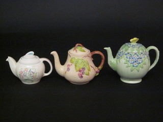 A Susie Cooper teapot, a Wade teapot and a green glazed  Burleigh teapot