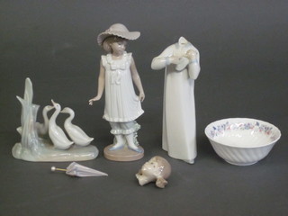 A Nao figure of a standing bonnetted girl 7 1/2", do. figure of geese 5", a Lladro figure of a girl, f, and a Wedgwood Wallace  Arnold Christmas 1998 bowl 4"