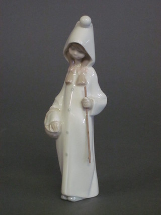 A Lladro figure of a standing girl with stick, the base marked Lladro 8"