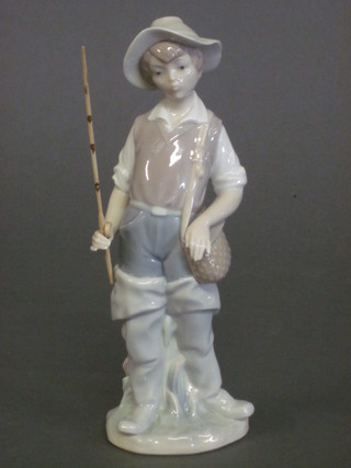 A Lladro figure of a standing boy with fishing rod 8 1/2"