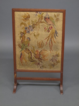 An oak fire screen with woolwork panel depicting birds, 21"