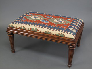 A rectangular Victorian style mahogany stool with Kelim  upholstered seat, raised on turned and fluted supports 37"