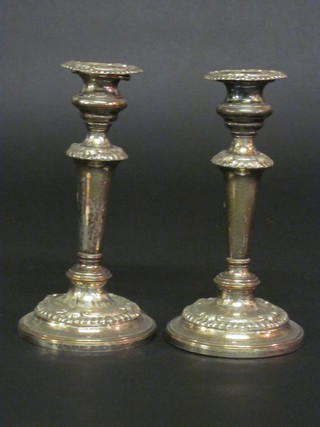 A pair of silver plated candlesticks with detachable sconces 8"