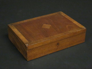 A rectangular walnut trinket box with hinged lid 11"