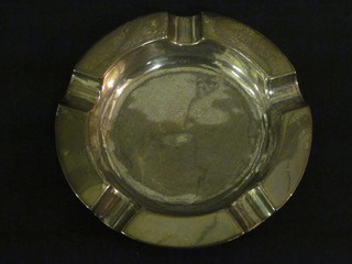 A circular silver ashtray, marks rubbed 2 1/2 ozs
