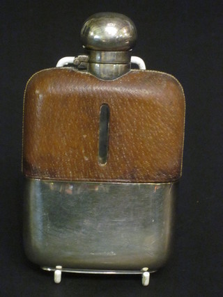 A glass and silver plated hip flask with detachable cup