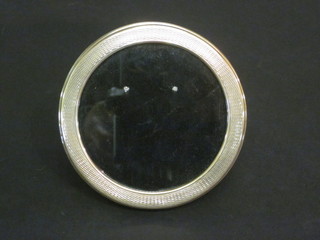 A circular silver easel photograph frame 4" with engine turned decoration